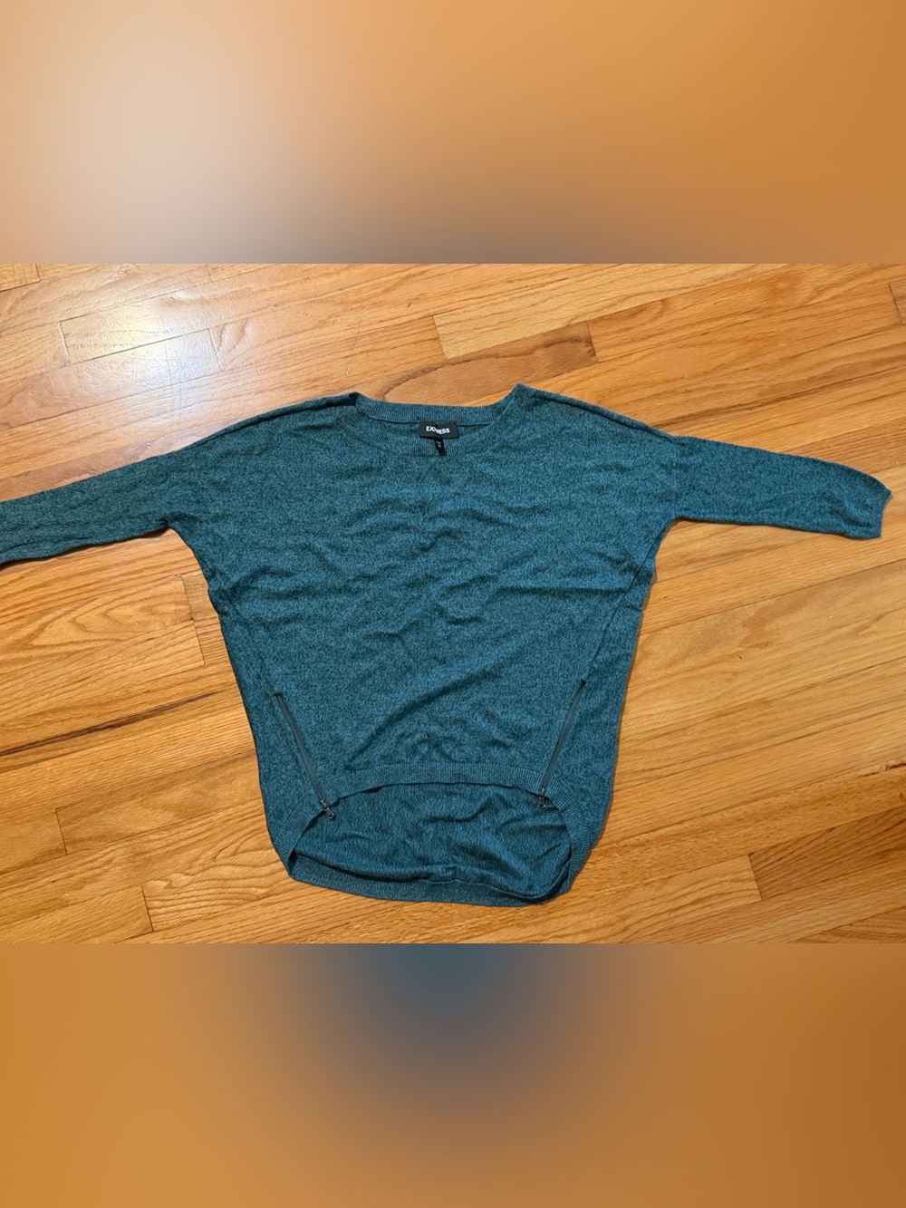 Express green knit sweater featuring a hi-low hem and side zippers